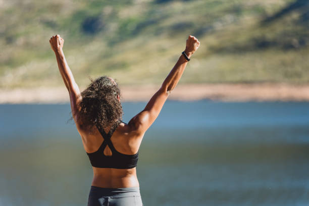 Shot of a sporty young woman cheering after finishing her workout